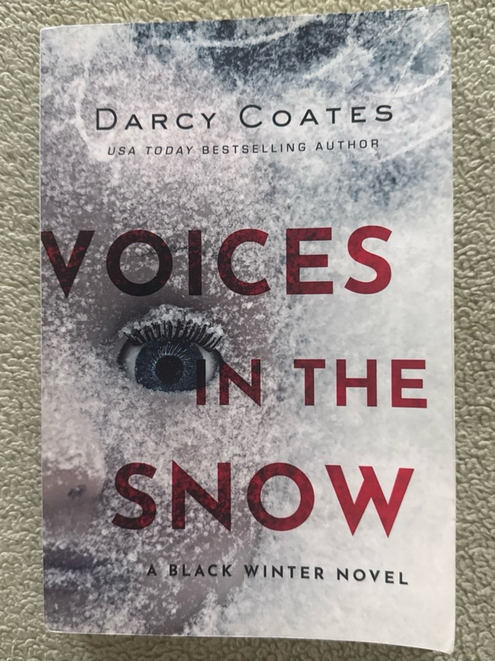 Voices in the Snow by Darcy Coates - White & Red Paperback Novel